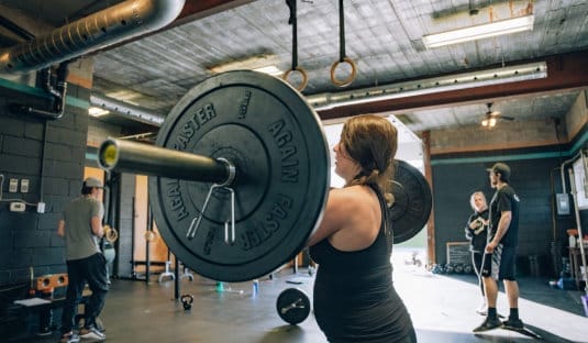 Woman lifting at CrossFit Training